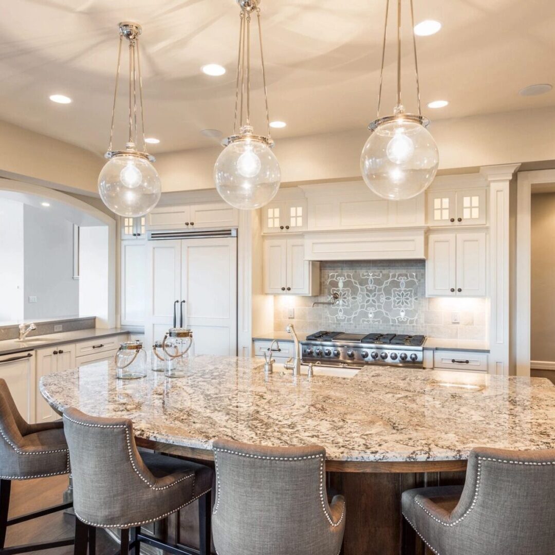 A large kitchen with a round table and chairs